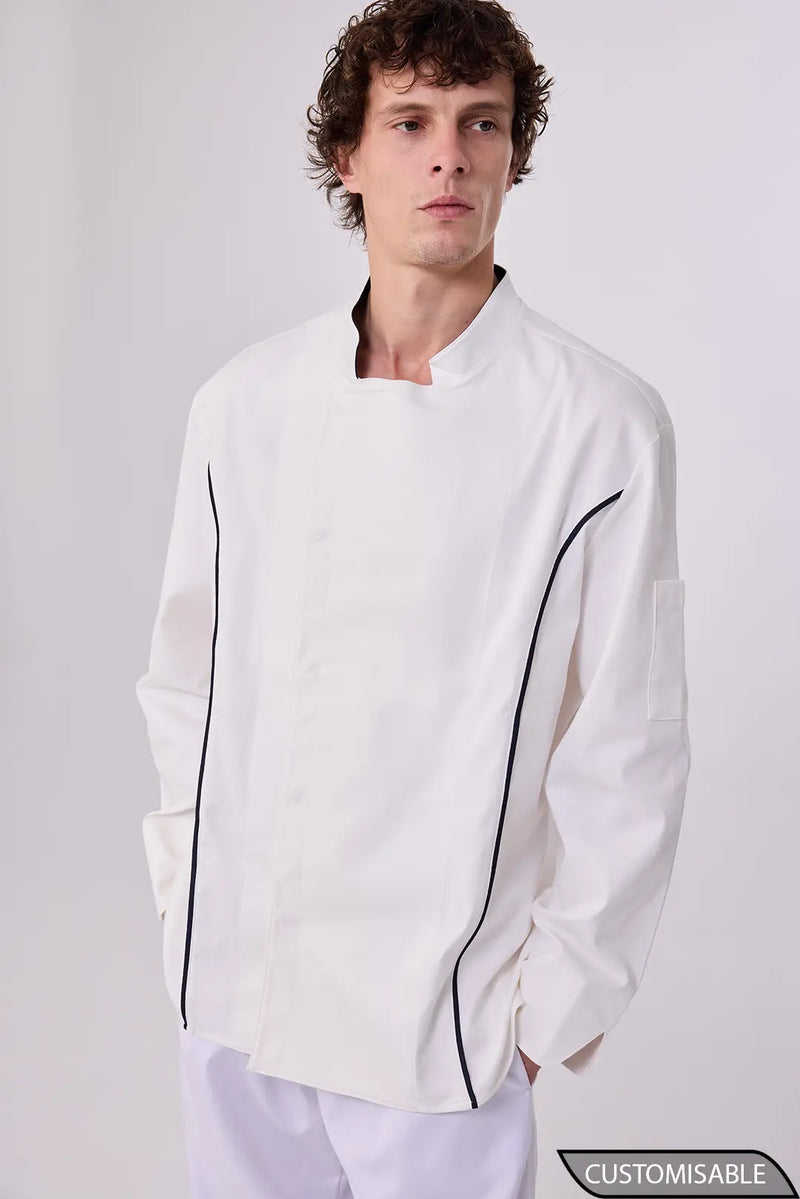 Chef in a white double-breasted chef jacket with black contrast piping